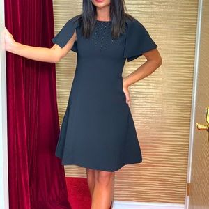 Butterfly shoulder cape mini dress.